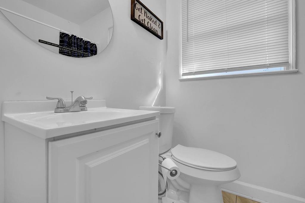 1124 Longshore Drive Decatur, GA 30032 - Photo 13 of 18 a bathroom with a sink a toilet and a mirror