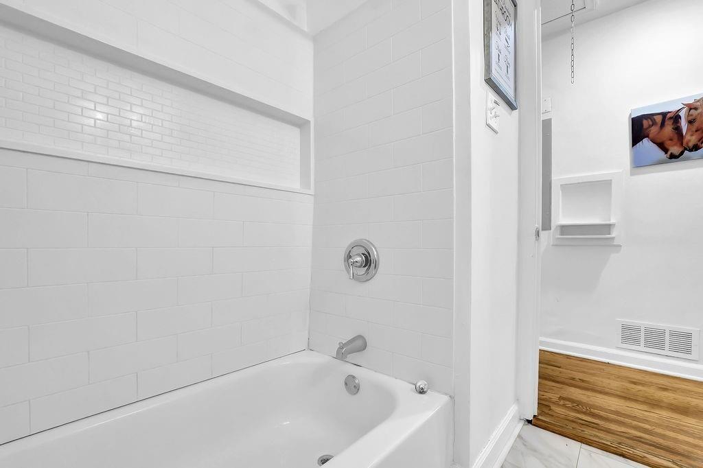 1124 Longshore Drive Decatur, GA 30032 - Photo 14 of 18 a bathroom with a bathtub