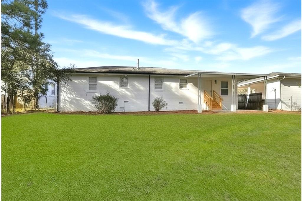 1124 Longshore Drive Decatur, GA 30032 - Photo 18 of 18 a view of a back yard of the house with green space