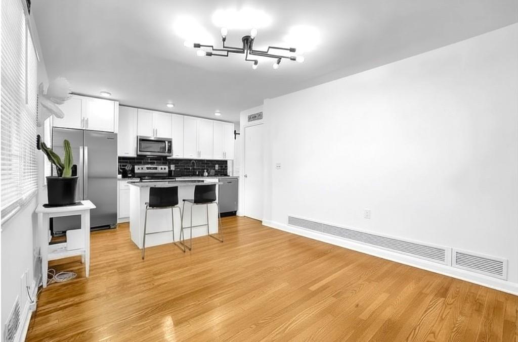 1124 Longshore Drive Decatur, GA 30032 - Photo 4 of 18 a view of a kitchen with microwave and cabinets