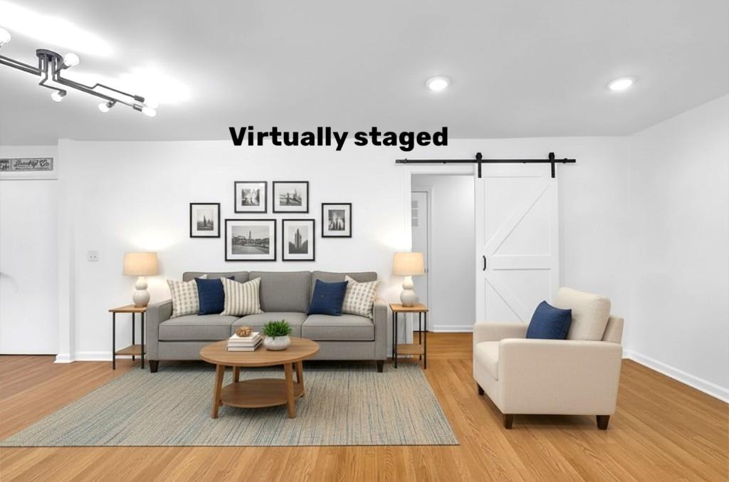 1124 Longshore Drive Decatur, GA 30032 - Photo 5 of 18 a living room with furniture and a wooden floor