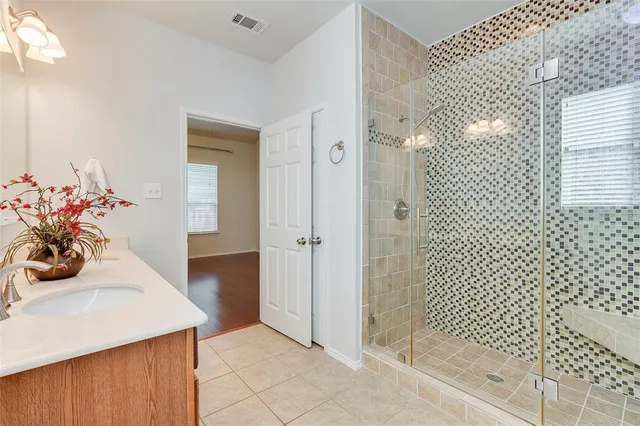 a view of a closet area with cabinets