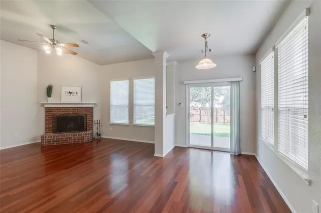a large kitchen with kitchen island granite countertop a large stove a sink and white cabinets
