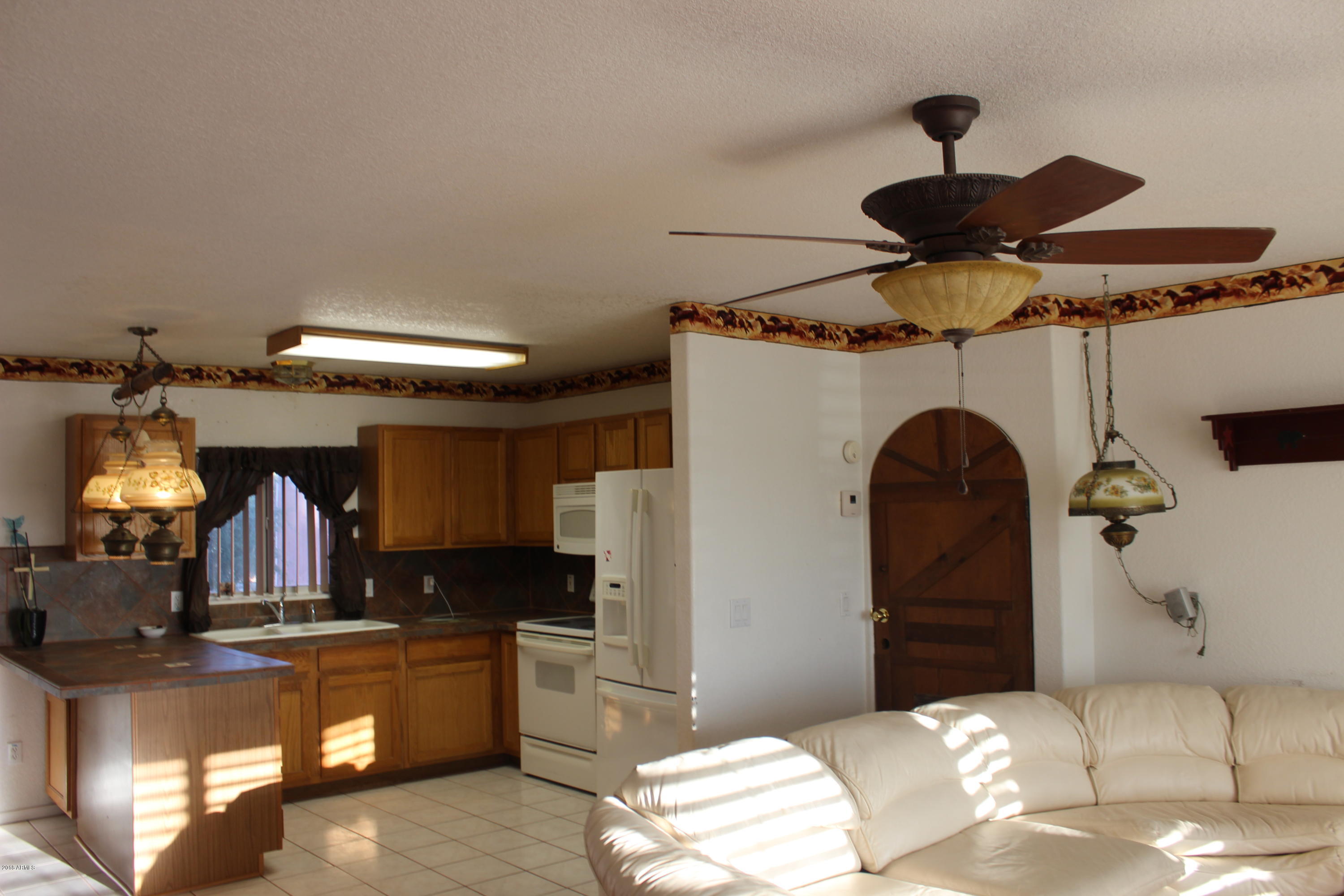1351 North Tomahawk Road Apache Junction, AZ 85119 - Photo 10 of 43 Greatroom with Door closed