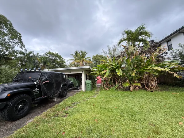 a view of a car in front of a house