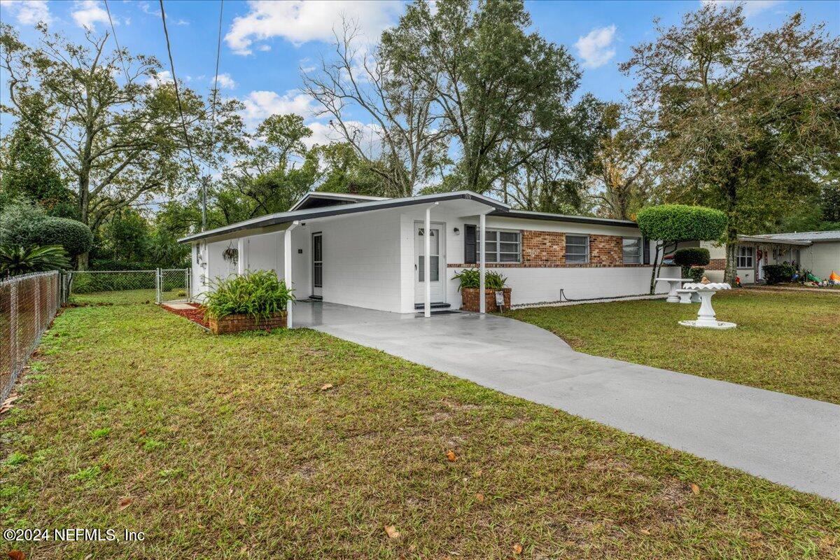 7616 Rambler Road Jacksonville, FL 32244 - Photo 2 of 16 a view of a house with backyard and sitting area
