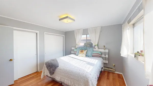 a bedroom with a bed and a view of bathroom