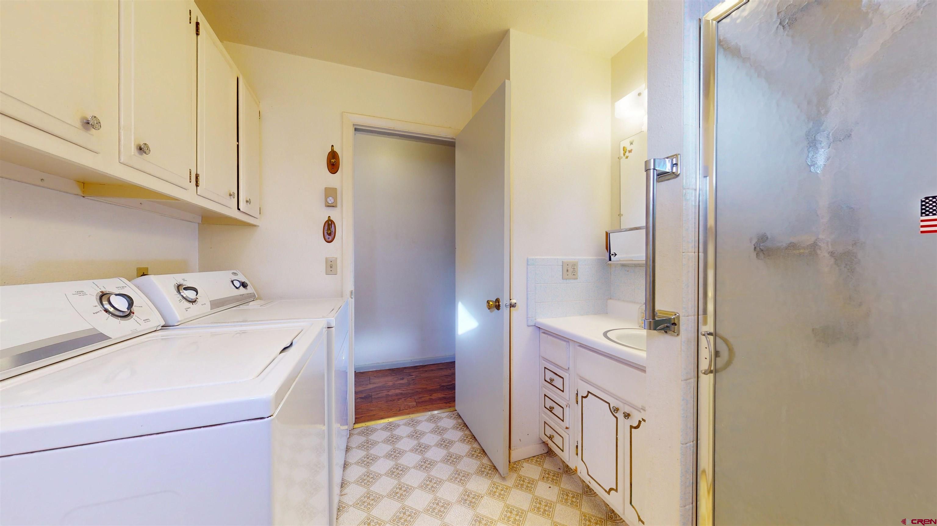 205 Southeast Frontier Avenue Cedaredge, CO 81413 - Photo 20 of 41 a bathroom with a sink a toilet and shower