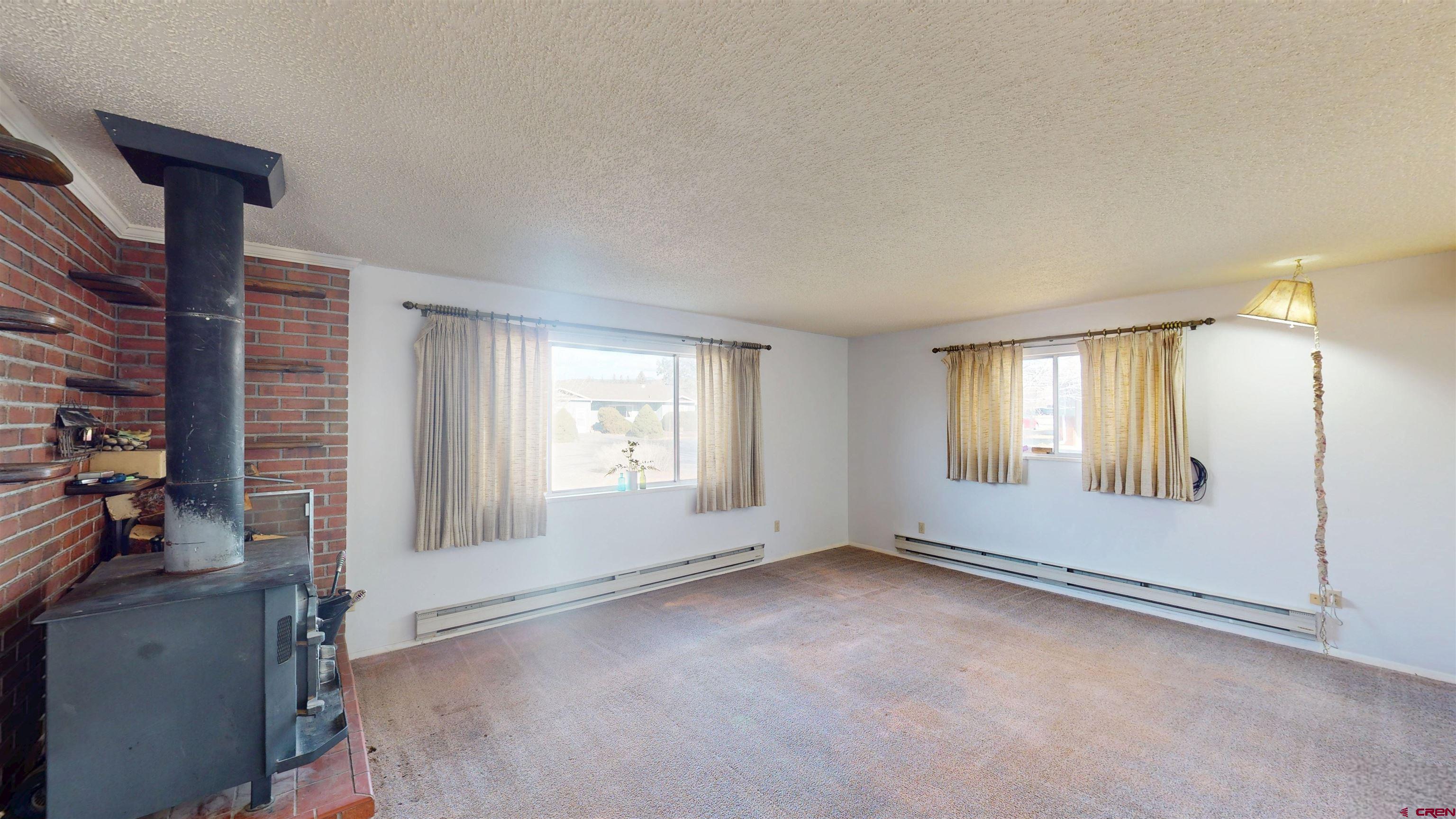 205 Southeast Frontier Avenue Cedaredge, CO 81413 - Photo 21 of 41 a view of an empty room with a window