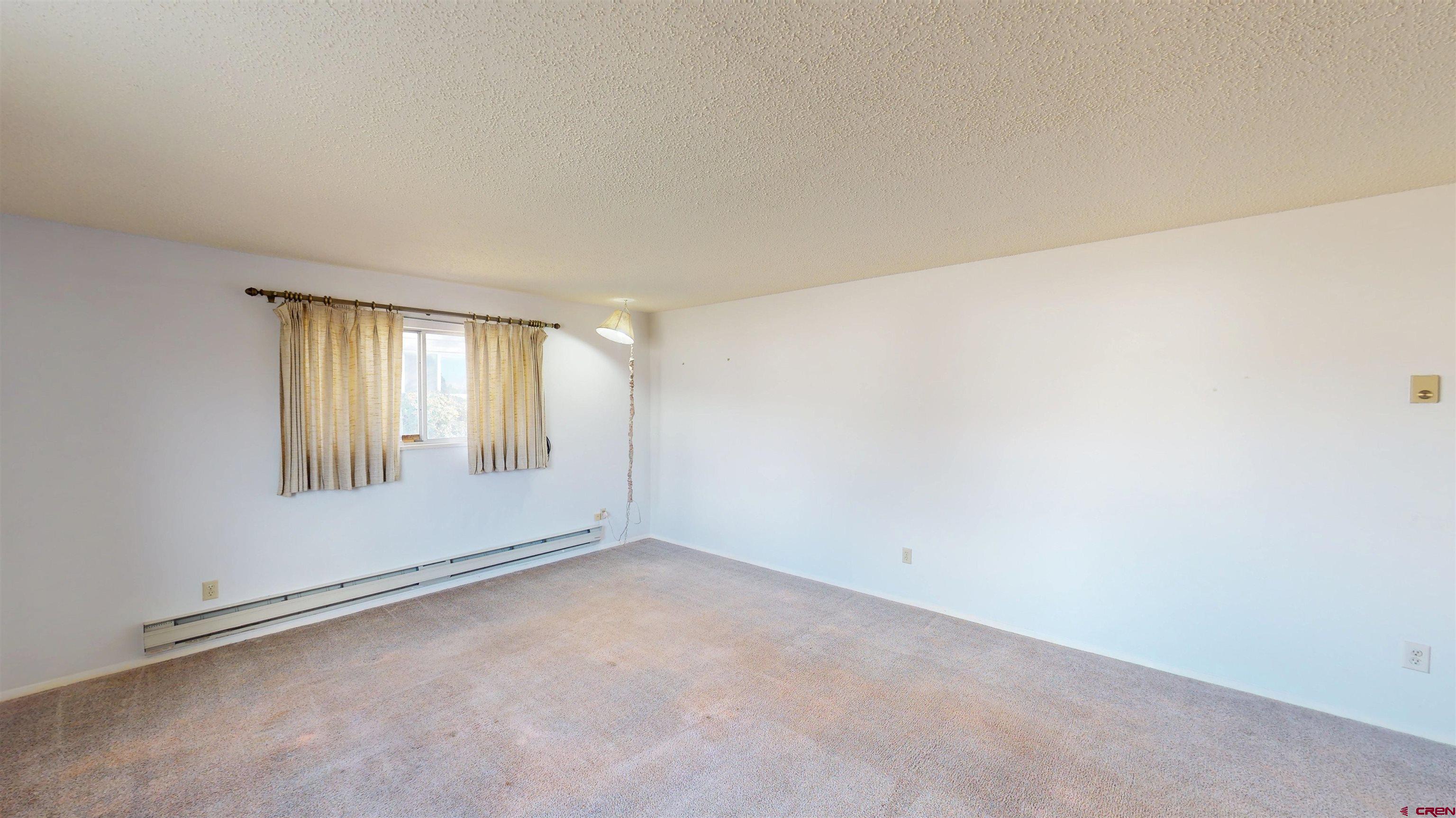 205 Southeast Frontier Avenue Cedaredge, CO 81413 - Photo 25 of 41 a view of an empty room with a window