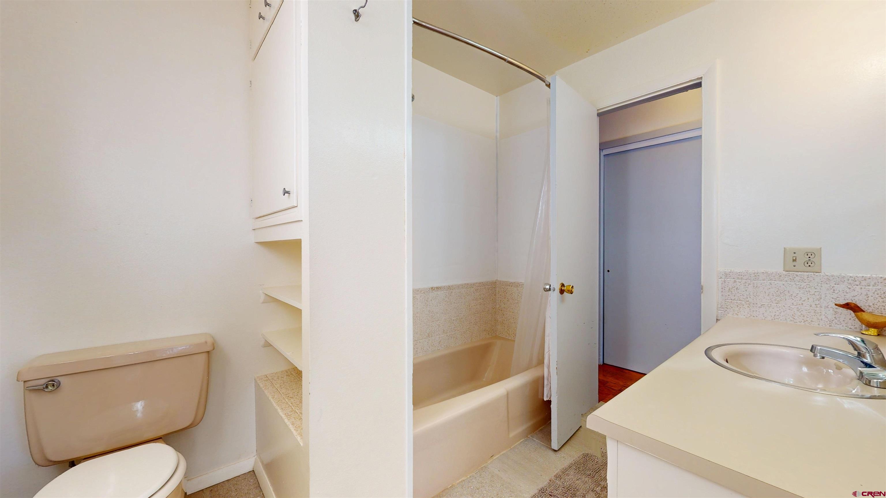205 Southeast Frontier Avenue Cedaredge, CO 81413 - Photo 29 of 41 a bathroom with a sink a toilet and shower