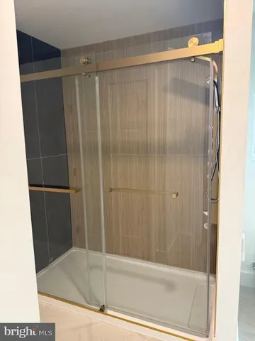 a bathroom with a shower and a tub