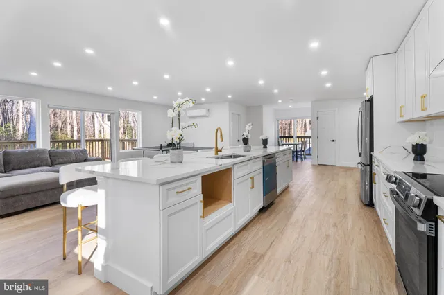 a stove top oven sitting inside of a kitchen