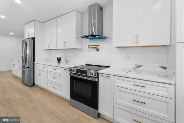 a kitchen with a sink appliances and cabinets