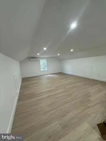 a view of room and hardwood floor