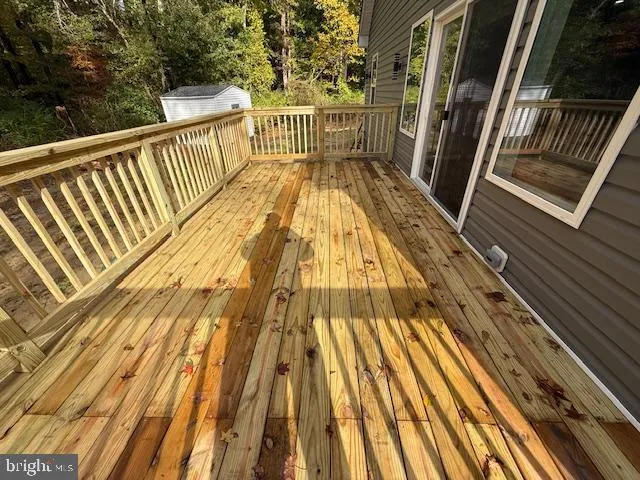 a view of balcony with wooden floor