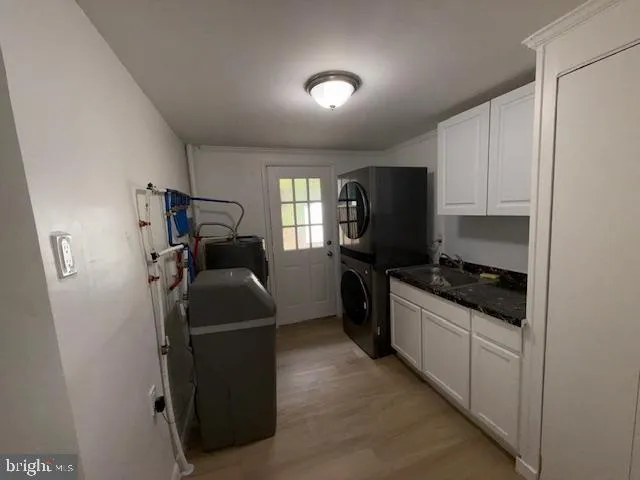 a kitchen with a refrigerator and a stove