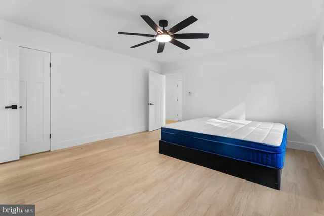 a view of a kitchen with wooden floor and stairs