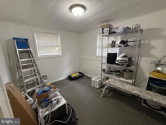 a room with furniture and gym equipment