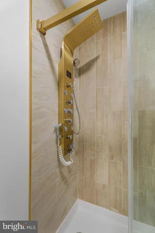 a bathroom with a toilet sink and shower