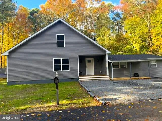 a backyard of a house with seating space