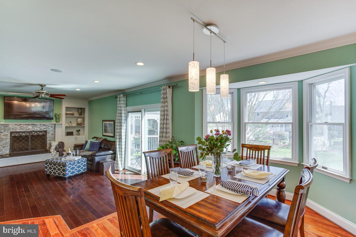 7883 Poplar Grove Road Severn, MD 21144 - Photo 18 of 77 a view of a dining room with furniture window and wooden floor