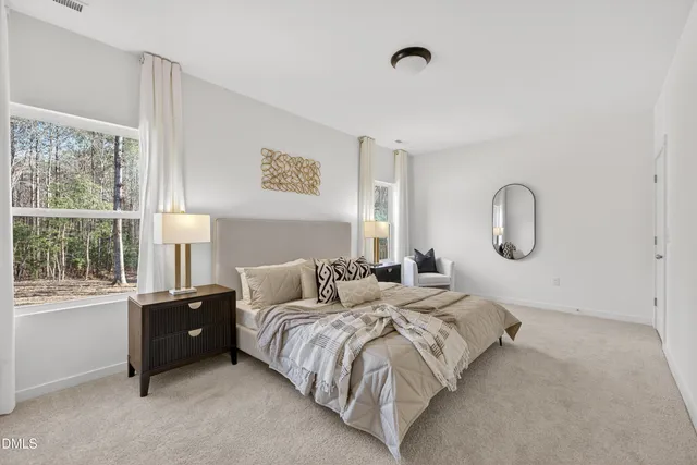 a bedroom with bed and window