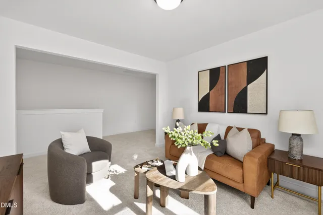 a living room with furniture and a lamp