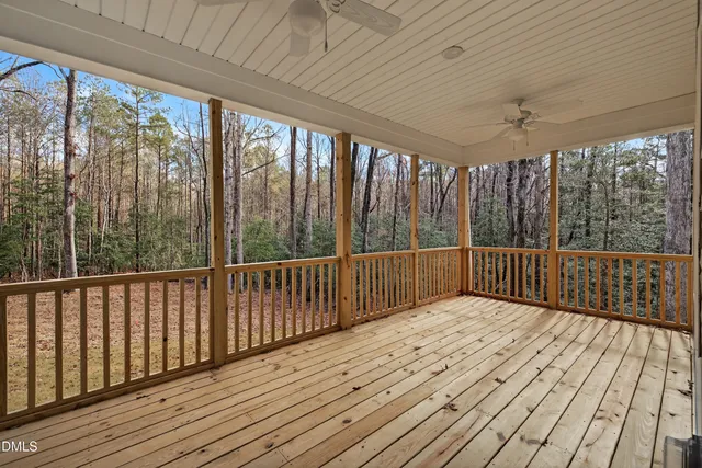 a view of balcony with wooden floor