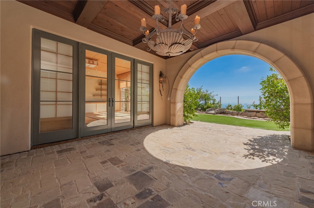 4 Starcatcher Newport Coast, CA 92657 - Photo 20 of 23 a view of a livingroom with a patio and garden