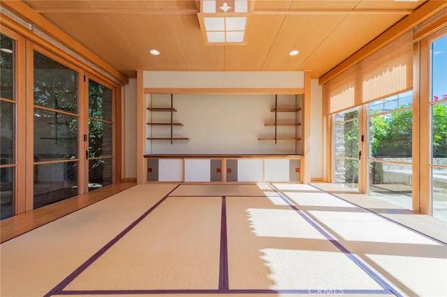 a bedroom with a large bed and a large window