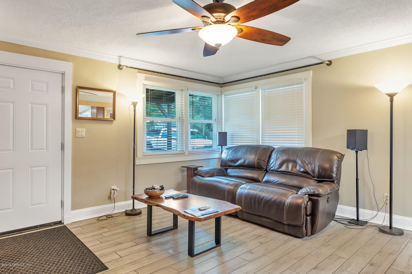 9767 Lily Road Jacksonville, FL 32246 - Photo 7 of 29 a living room with furniture and a wooden floor