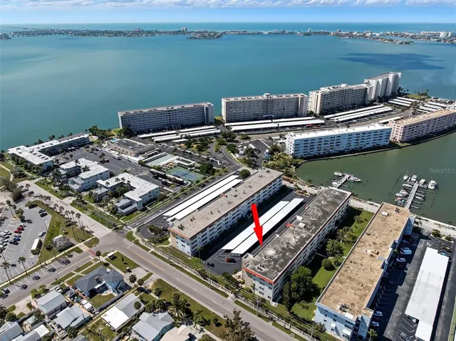 an aerial view of a city with lake