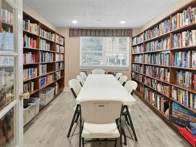 a view of a workspace with furniture in a room