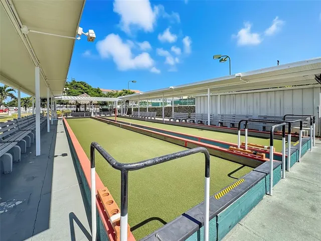 a view of a swimming pool with seating space