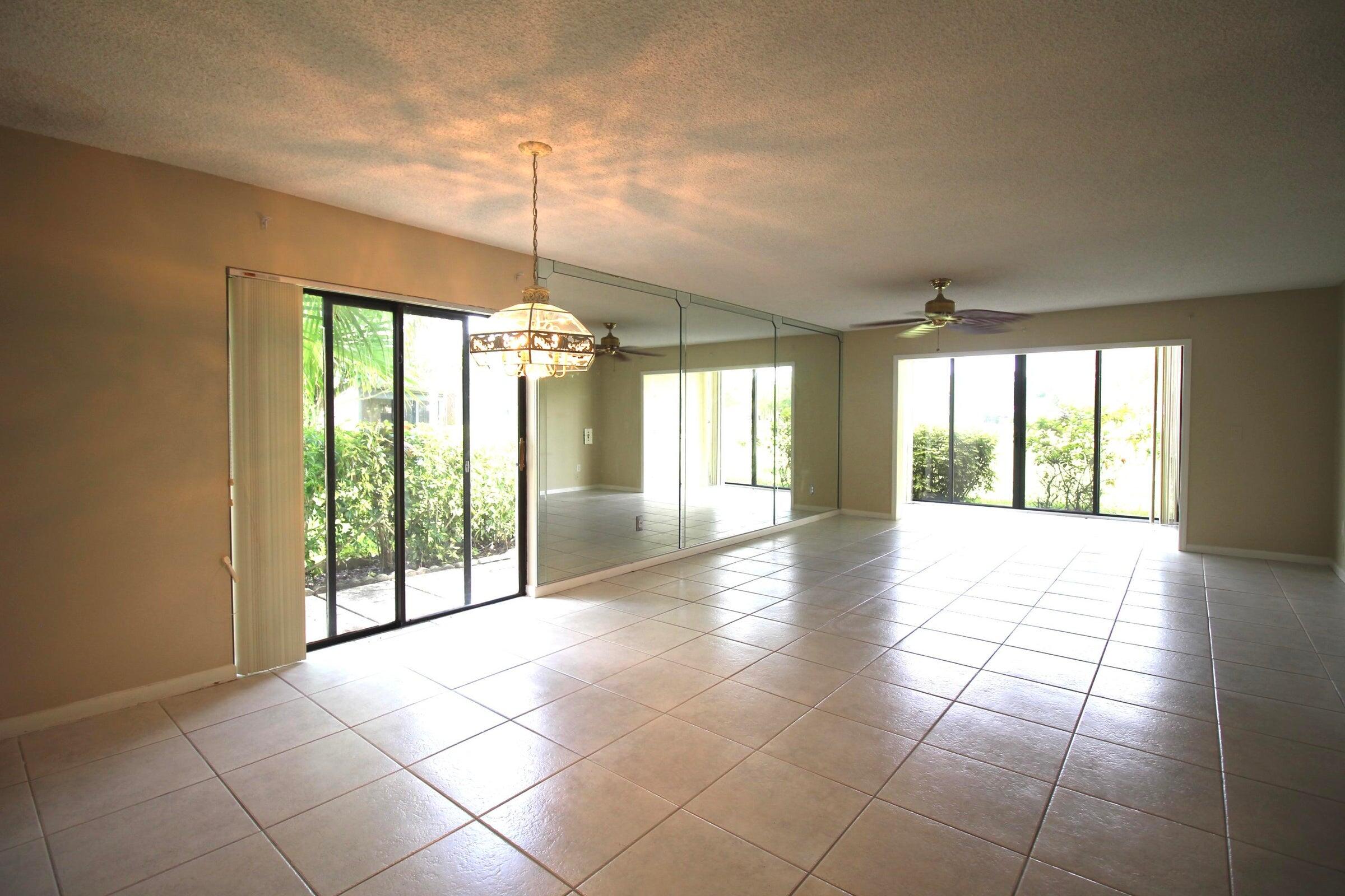 21766 Cypress Drive, Unit 20A Boca Raton, FL 33433 - Photo 14 of 21 a view of an entryway with a glass door