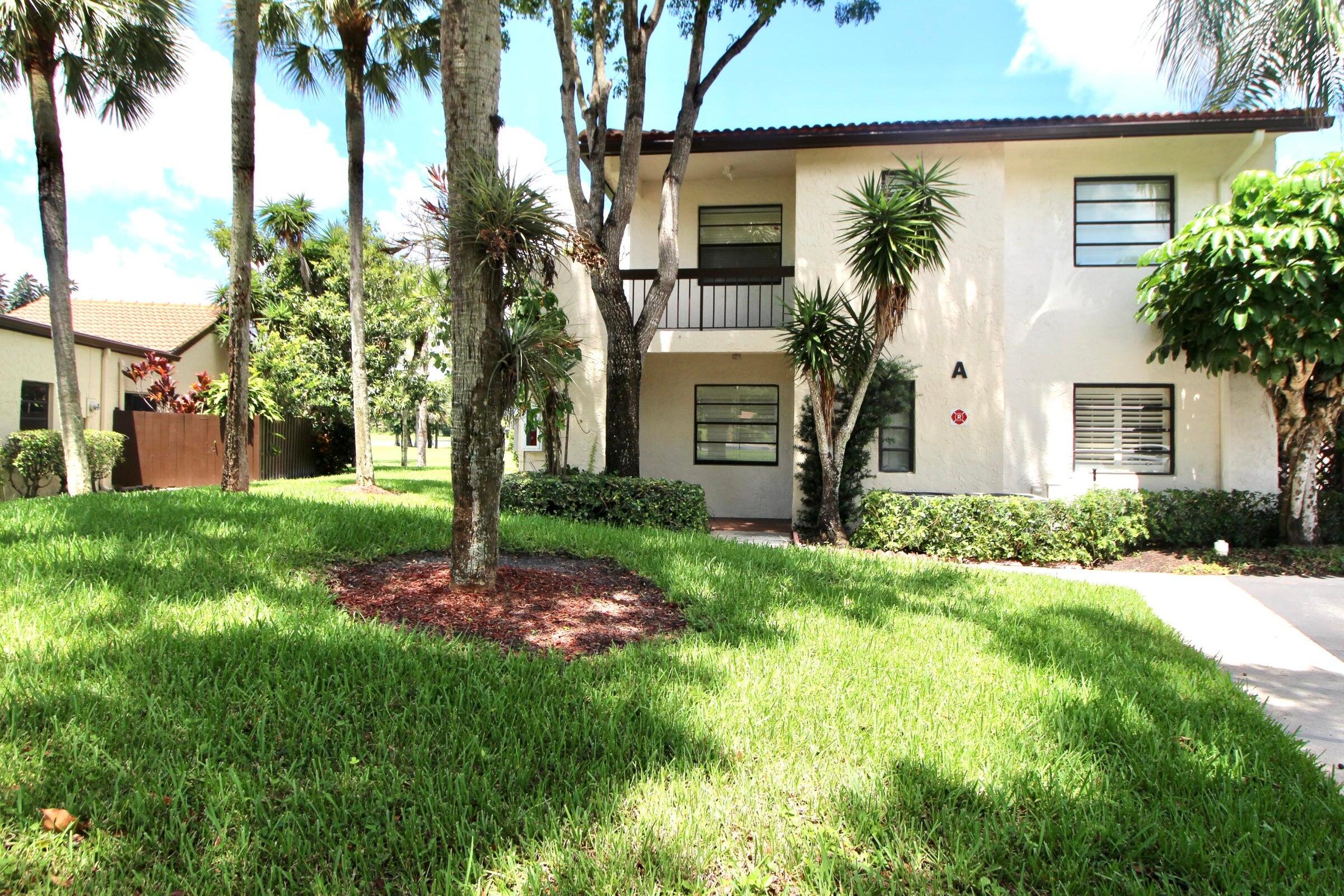 21766 Cypress Drive, Unit 20A Boca Raton, FL 33433 - Photo 15 of 21 a front view of a house with garden