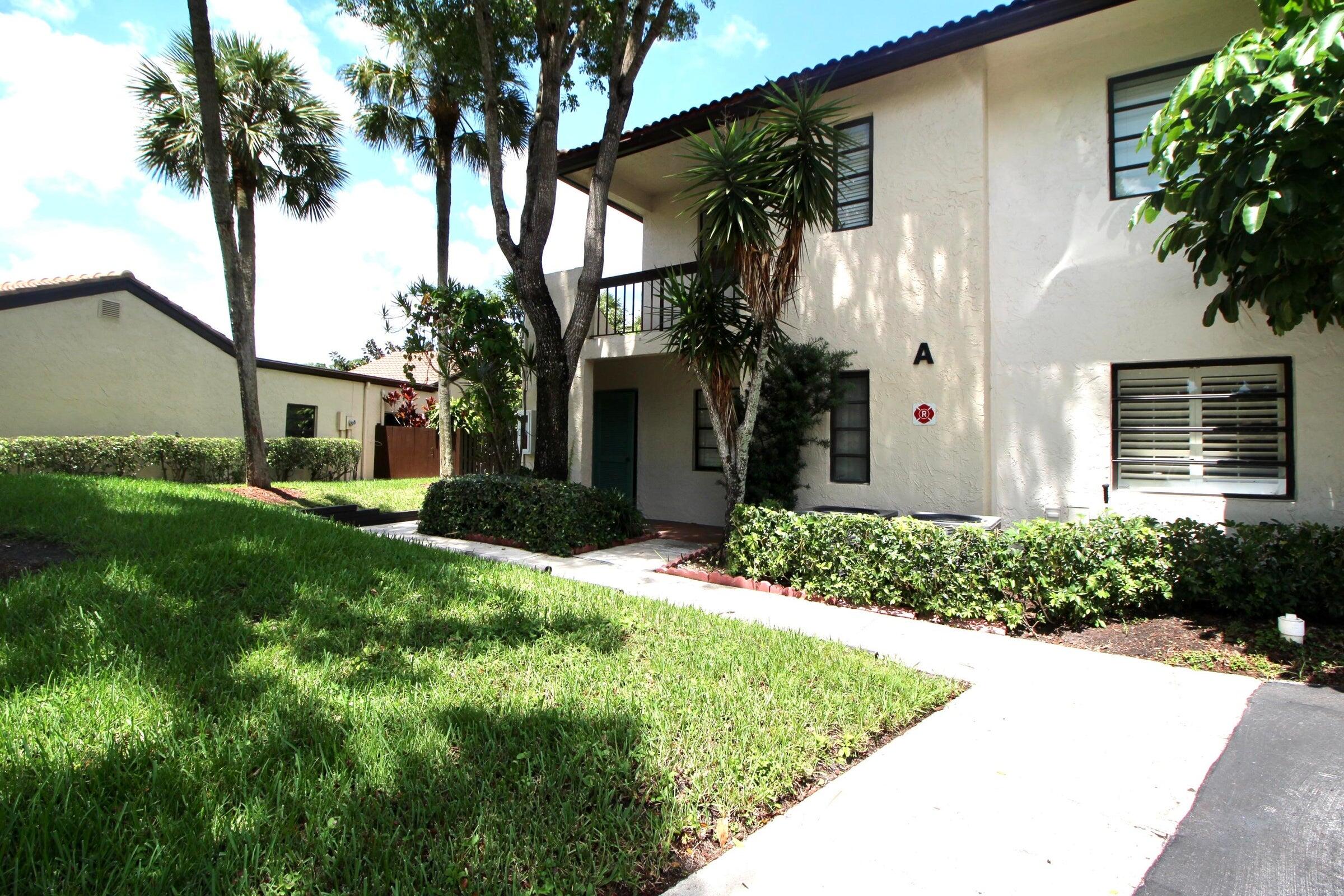 21766 Cypress Drive, Unit 20A Boca Raton, FL 33433 - Photo 16 of 21 a front view of a house with garden