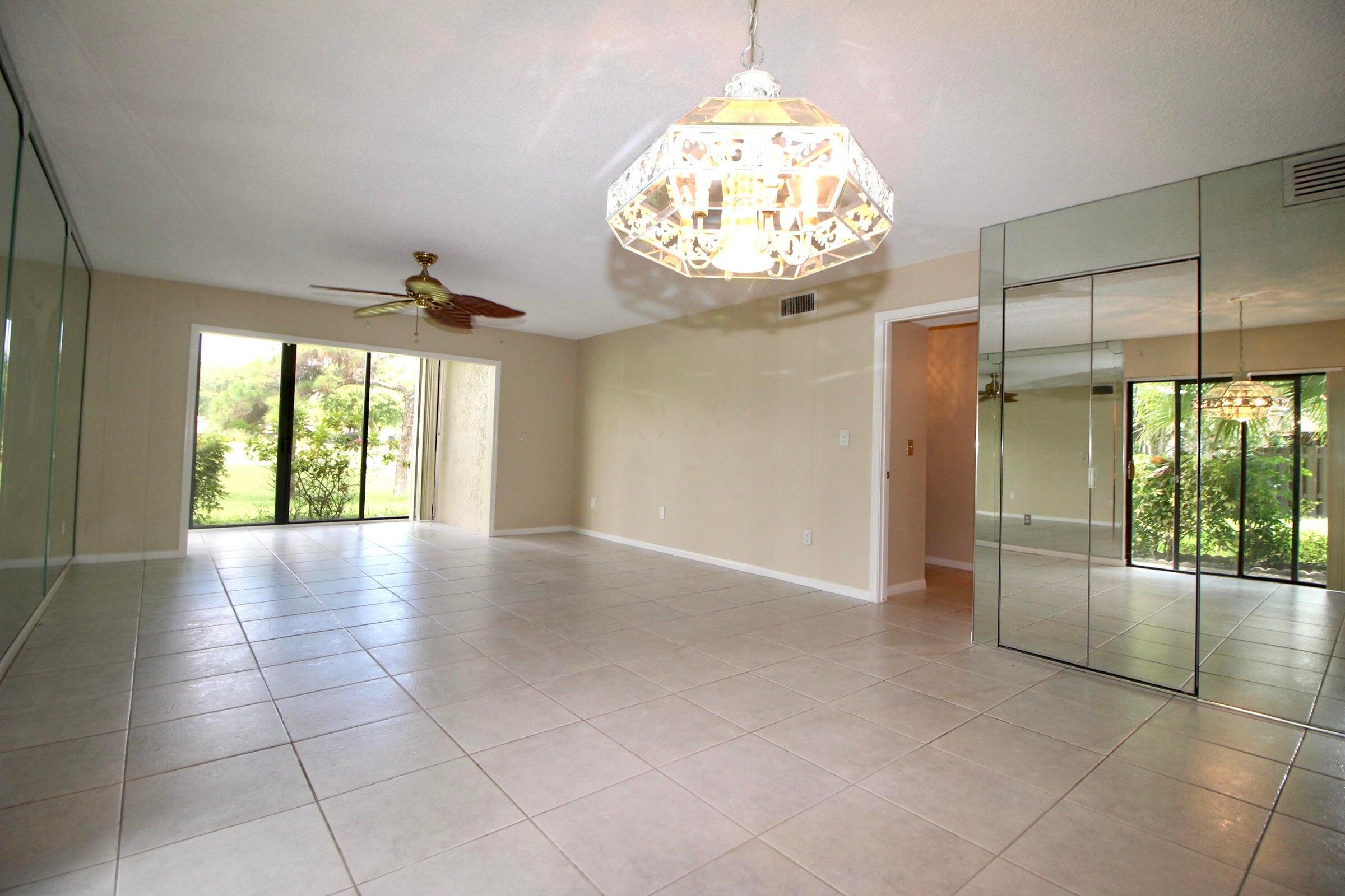 21766 Cypress Drive, Unit 20A Boca Raton, FL 33433 - Photo 4 of 21 a view of an empty room with a window