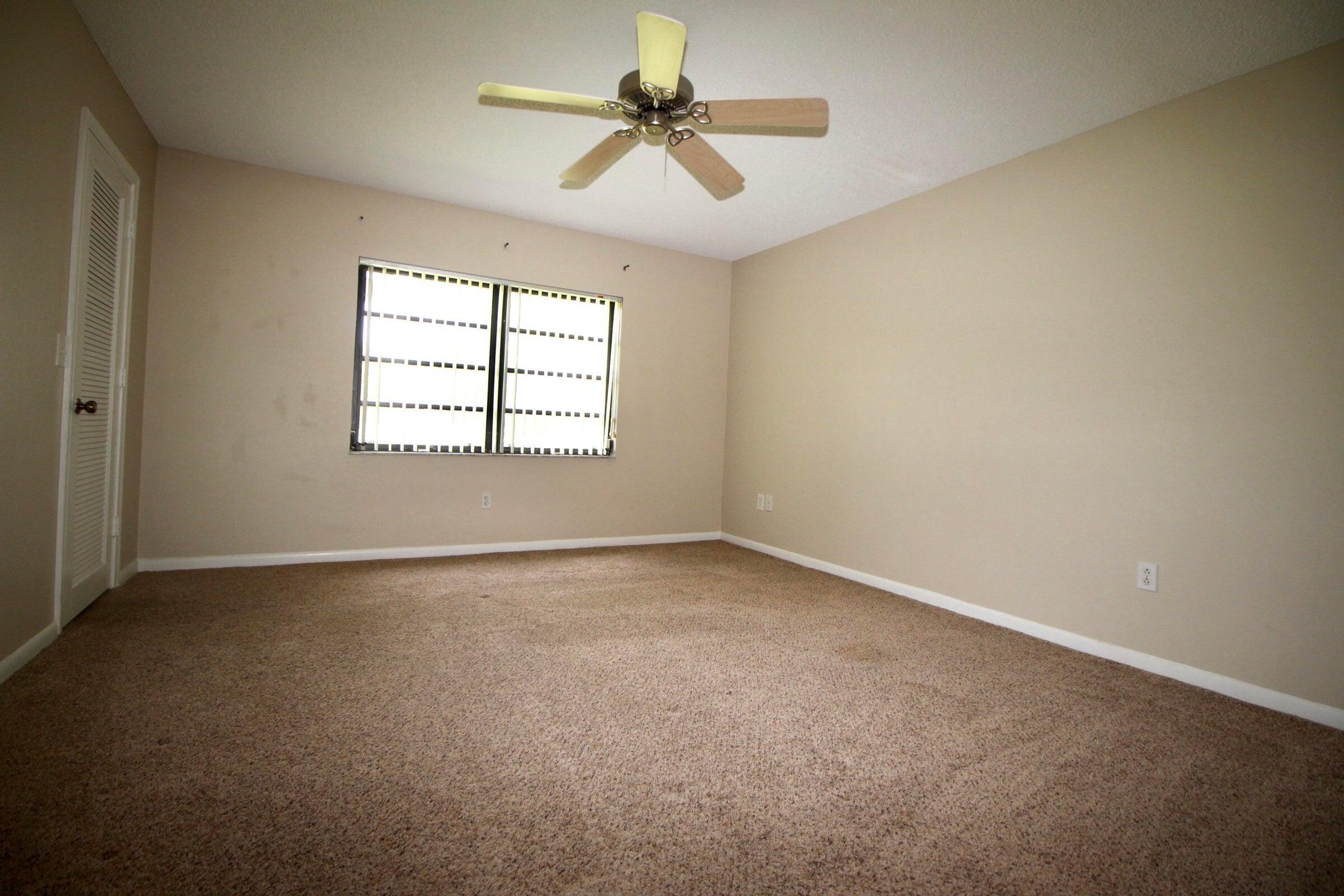 21766 Cypress Drive, Unit 20A Boca Raton, FL 33433 - Photo 7 of 21 an empty room with windows and fan