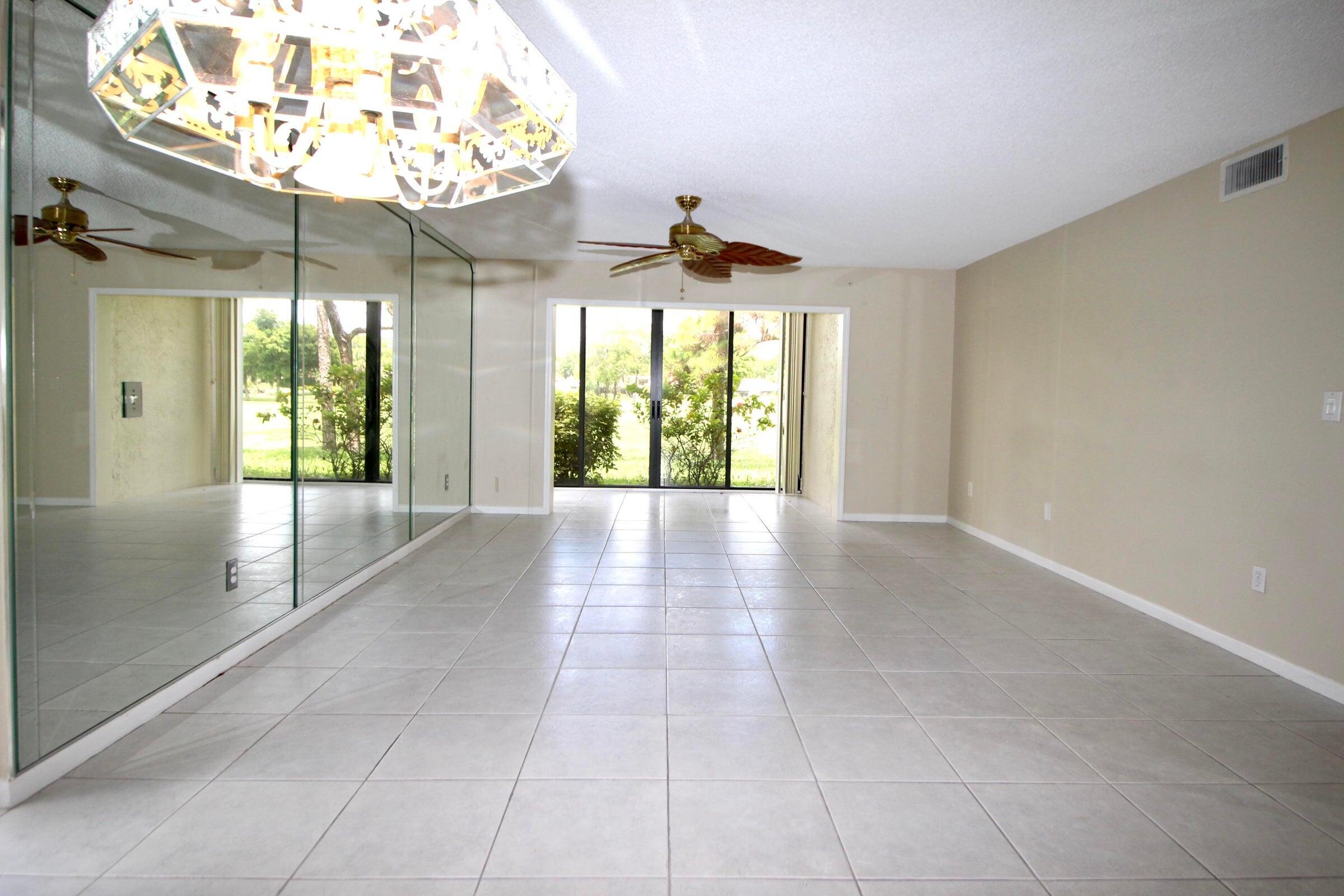 21766 Cypress Drive, Unit 20A Boca Raton, FL 33433 - Photo 8 of 21 a view of an entryway with a chandelier