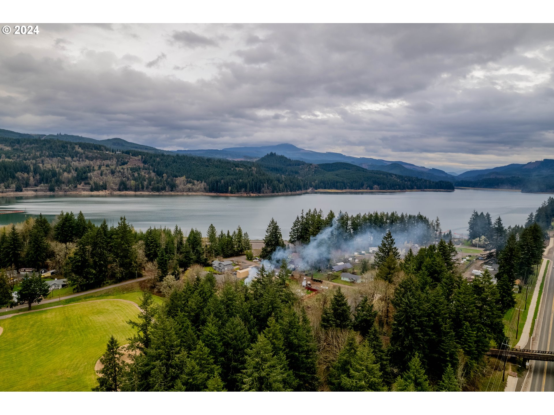56th Avenue Sweet Home, OR 97386 - Photo 20 of 20 a view of a lake with houses in the back