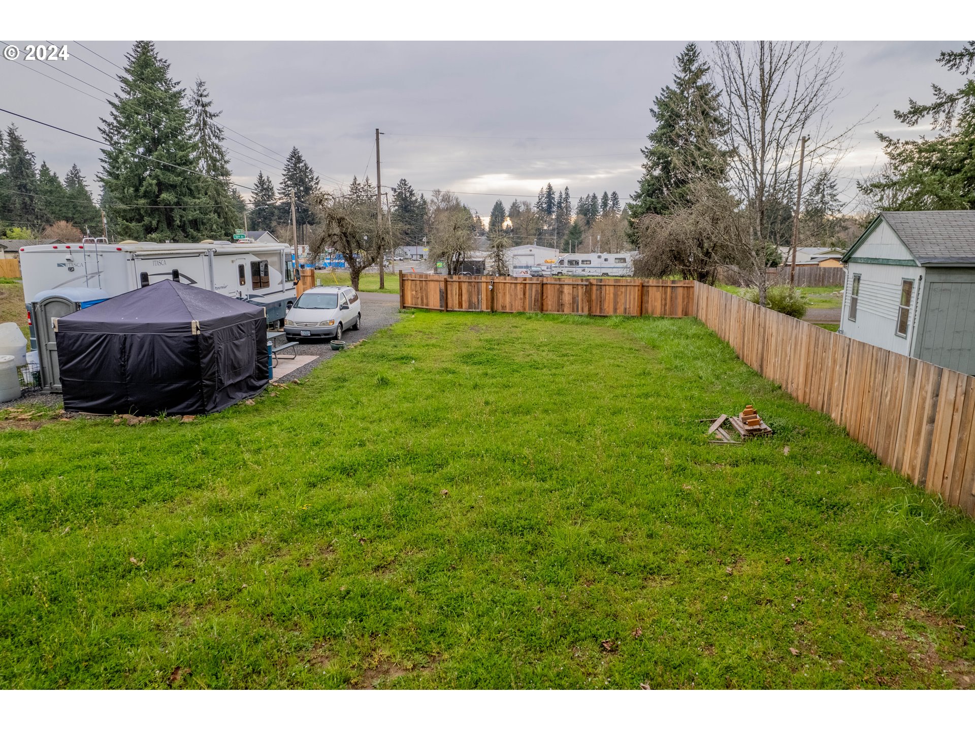56th Avenue Sweet Home, OR 97386 - Photo 8 of 20 a view of a yard with a house in the background