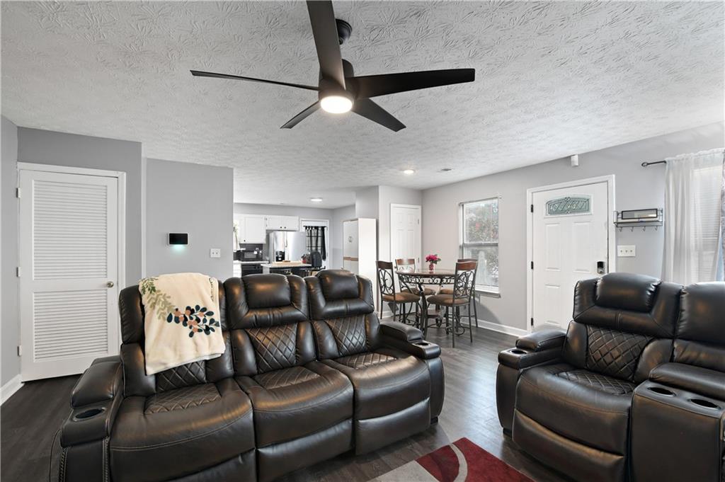 2303 Wingfoot Place Decatur, GA 30035 - Photo 2 of 10 a living room with furniture and a wooden floor