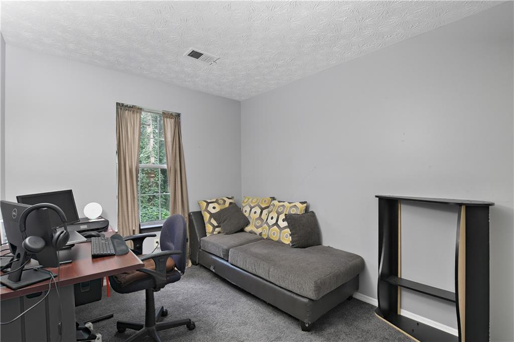 2303 Wingfoot Place Decatur, GA 30035 - Photo 5 of 10 a living room with furniture and a window