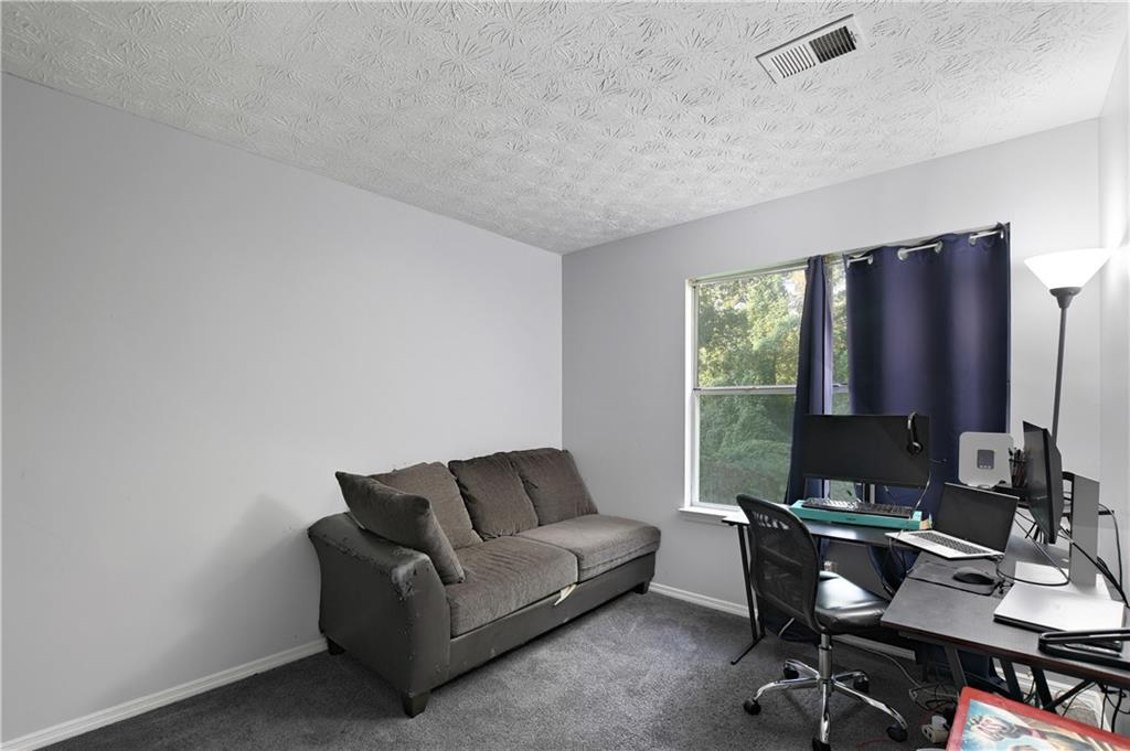 2303 Wingfoot Place Decatur, GA 30035 - Photo 6 of 10 a living room with furniture lamp and a window