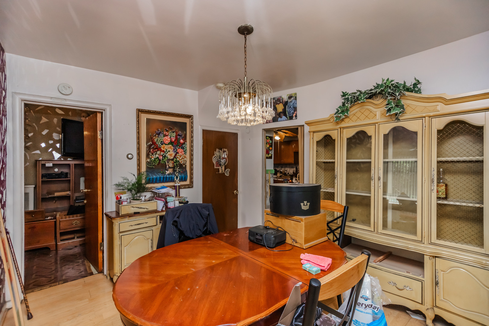 1146 West 88th Street Chicago, IL 60620 - Photo 6 of 23 a view of a dining room with furniture and chandelier