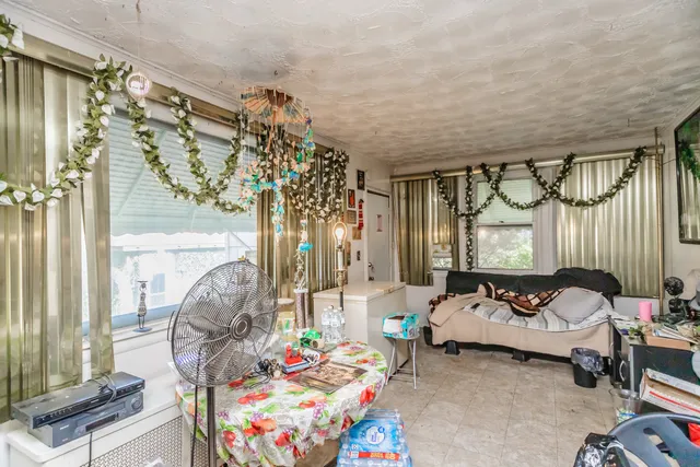 a bedroom with furniture and a chandelier