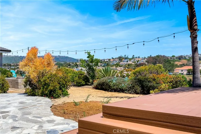 a view of a yard and an ocean view