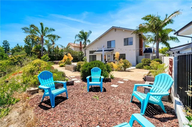 a swimming pool with outdoor seating